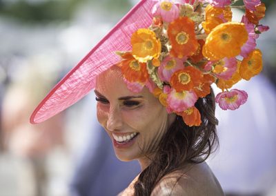 Megan Whitlock, from Dallas, pops in the paddock in striking hot pink and orange.