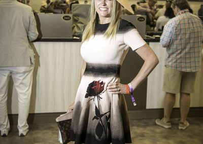 Christen Ritchey from Boca Raton in an elegant rose-print dress and hatinator.