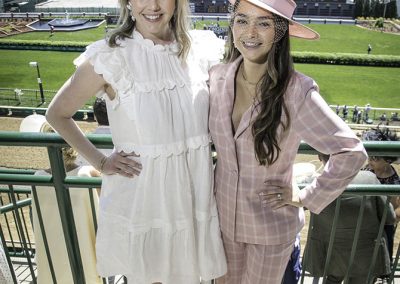 Allison and Natalie Alcock in two contrasting trends: ruffled dress and sleek pantsuit.