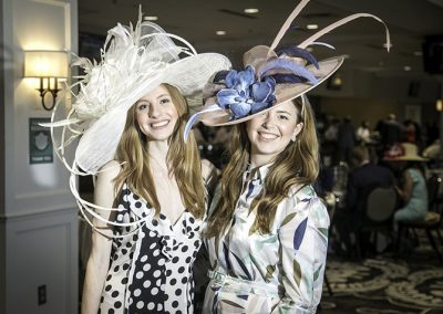 Drew and Jordan Carlos from Atlanta in big brims and long hemlines.