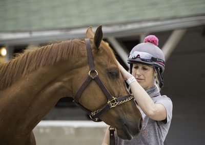 Exercise rider and local Pilates instructor, Jo Trout, with Purrfect Love.
